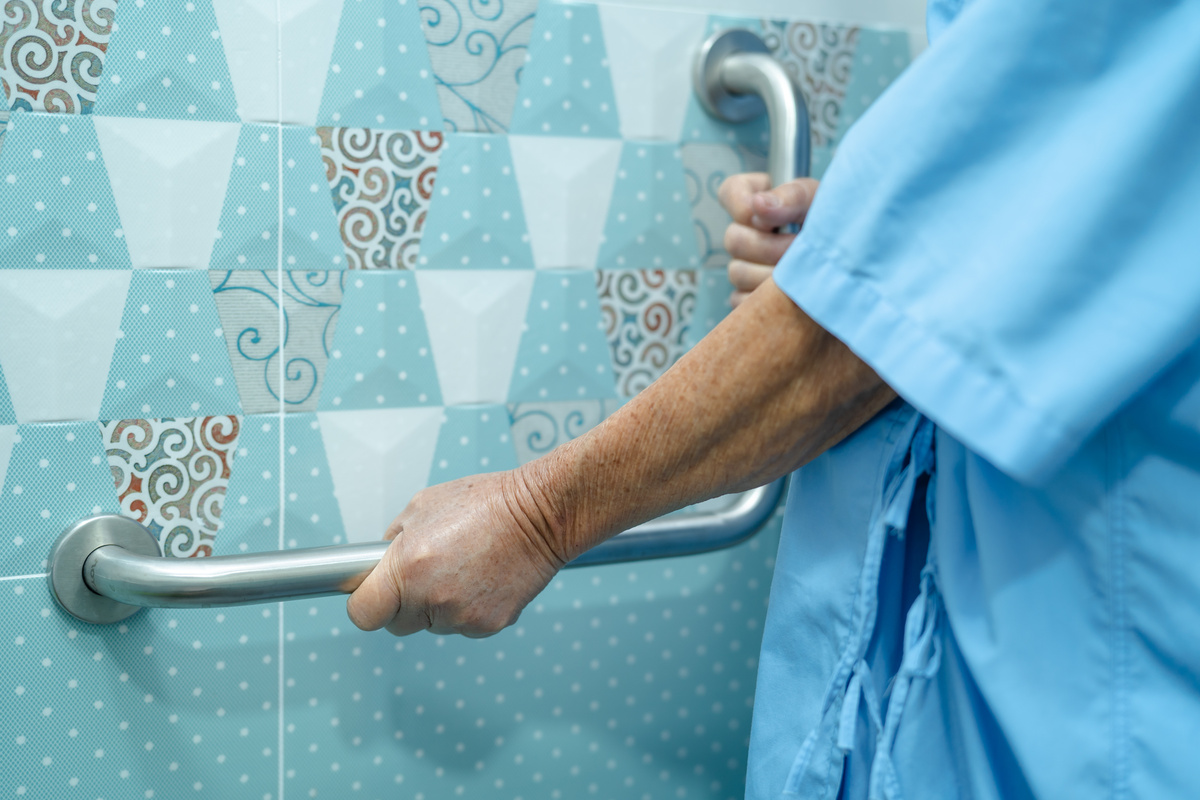 Asian Senior or Elderly Old Lady Woman Patient Use Toilet Bathro